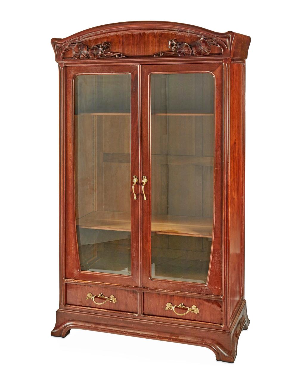 Appraisal: AN ART NOUVEAU WALNUT DOUBLE-DOOR BOOKCASEAn Art Nouveau walnut double-door