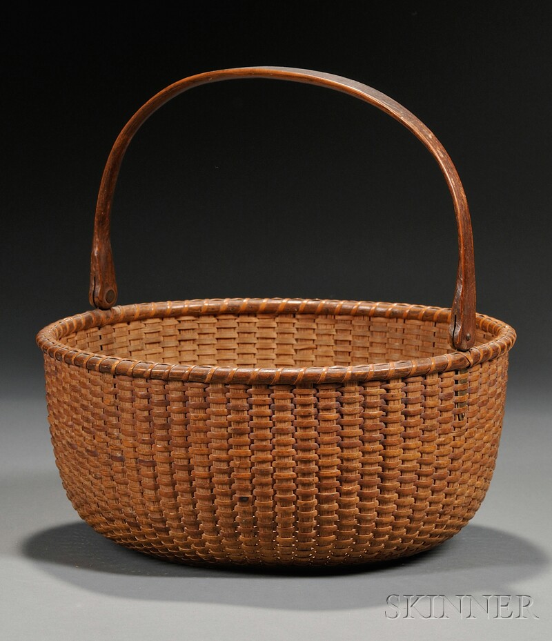 Appraisal: Nantucket Basket late th century round basket with carved hardwood