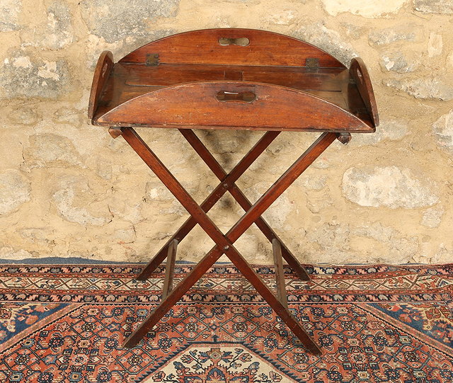 Appraisal: A LATE GEORGIAN MAHOGANY BUTLERS TRAY ON STAND with drop