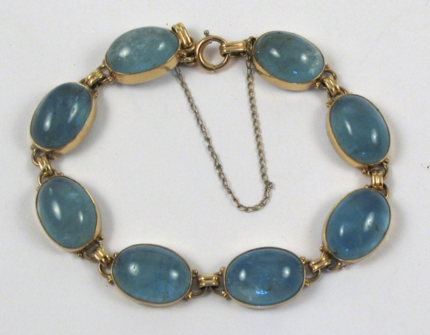 Appraisal: BLUE TOPAZ AND YELLOW GOLD BRACELET k gold and set