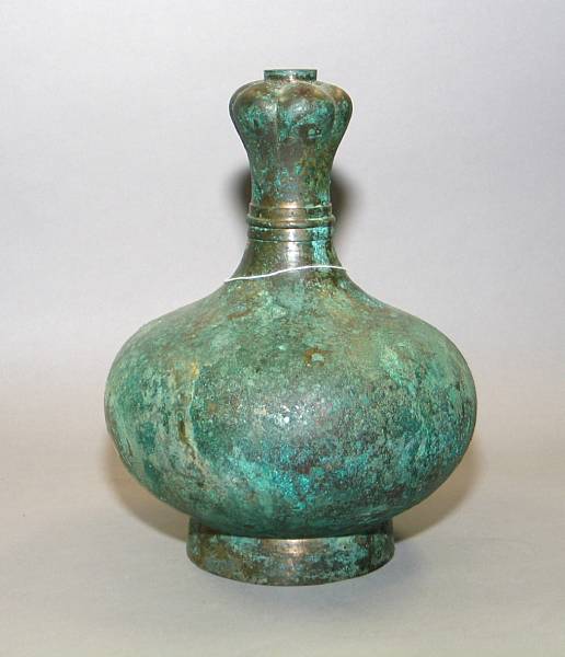 Appraisal: A Han style bronze garlic headed bottle Its body of