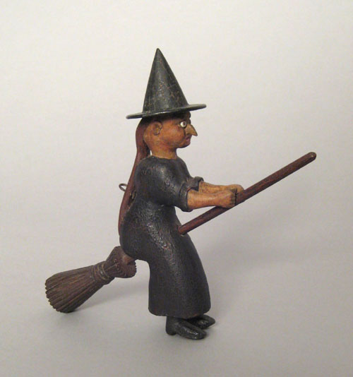 Appraisal: Carved and painted figure of a witch riding a broom