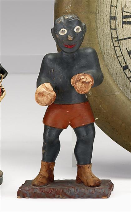 Appraisal: Carved and painted figure of a boxer th early th