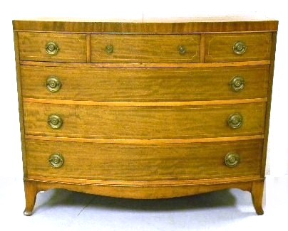 Appraisal: Federal style bowfront chest mahogany French feet three short drawers