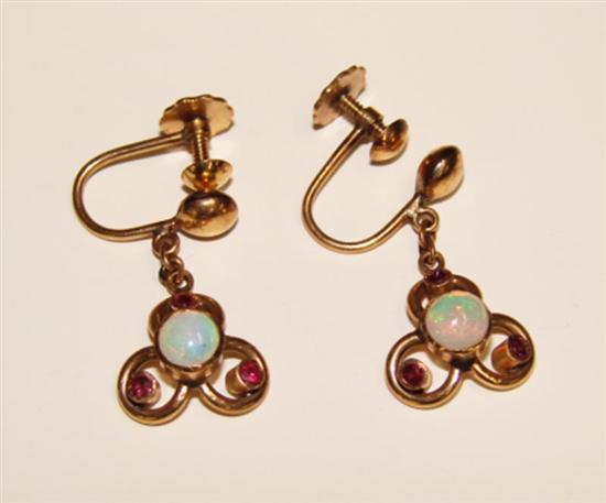 Appraisal: Fourteen karat yellow gold opal and garnet earrings