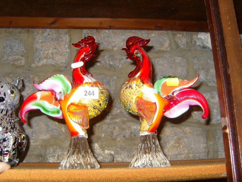 Appraisal: A pair of Venetian glass cockerels with red white orange