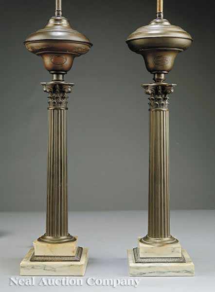 Appraisal: A Near Pair of American Classical Brass Solar Lamps mid-