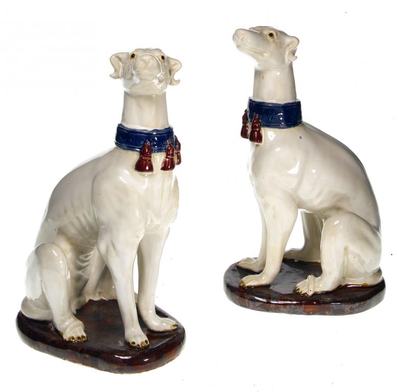 Appraisal: A PAIR OF ITALIAN MAIOLICA MODELS OF SEATED HOUNDS in