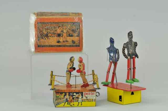 Appraisal: LOT OF TWO BOXER TOYS Lithographed tin and wood includes