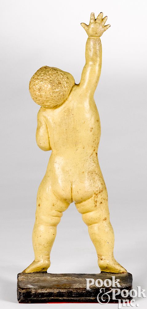 Appraisal: Cast iron naked reaching child doorstop Ella Rood Studios cast