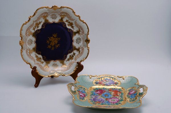 Appraisal: Two German porcelain platters One handled platter with handpainted floral