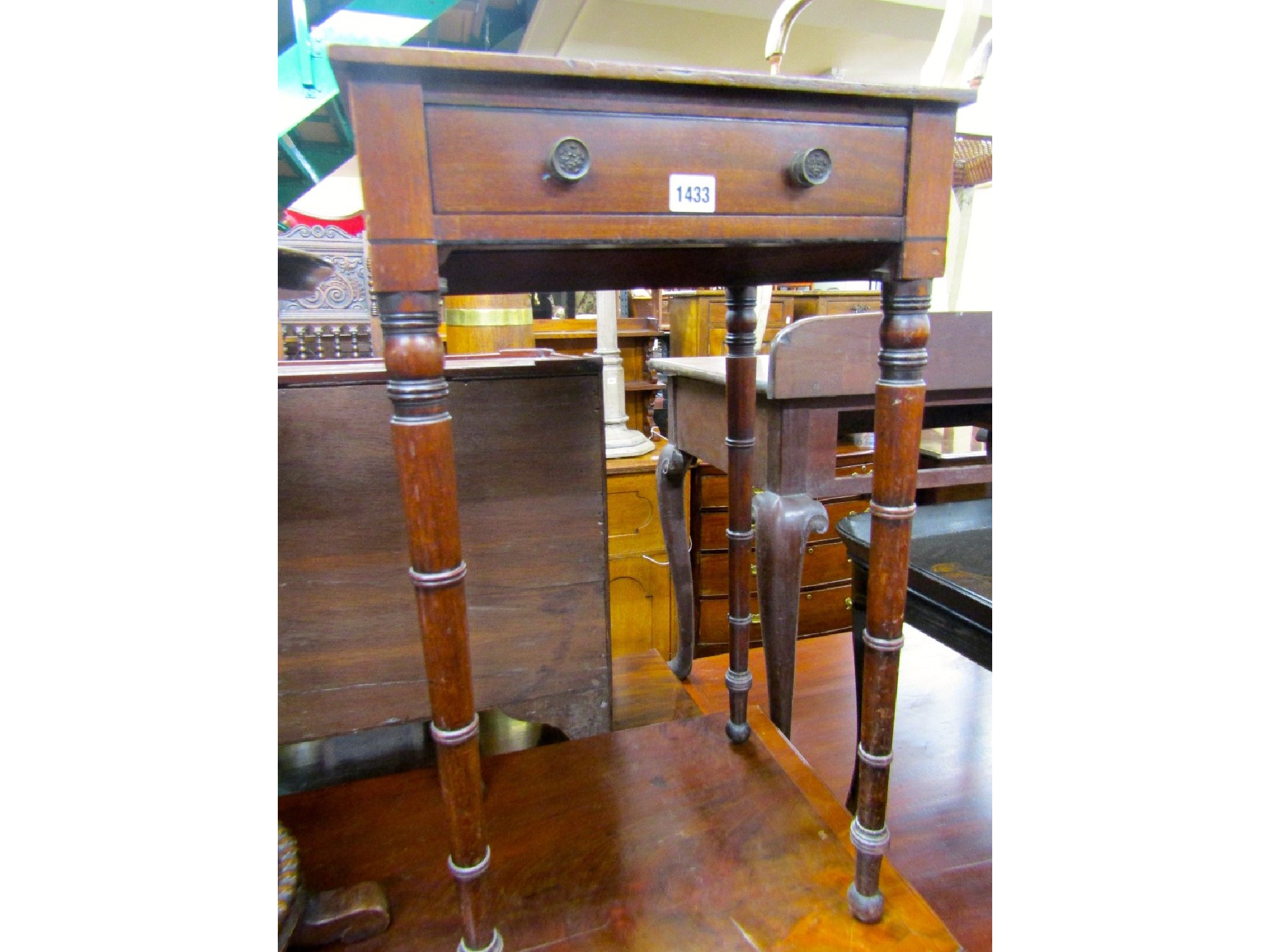 Appraisal: A small Regency mahogany ladies sewing table with a single