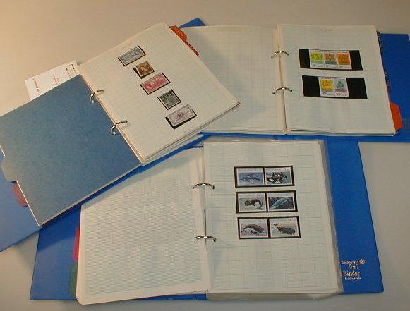 Appraisal: Philatelic Three blue loose leaf albums - New Zealand