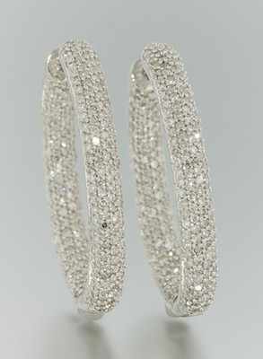 Appraisal: A Pair of k Gold and Diamond Oval Hoops k