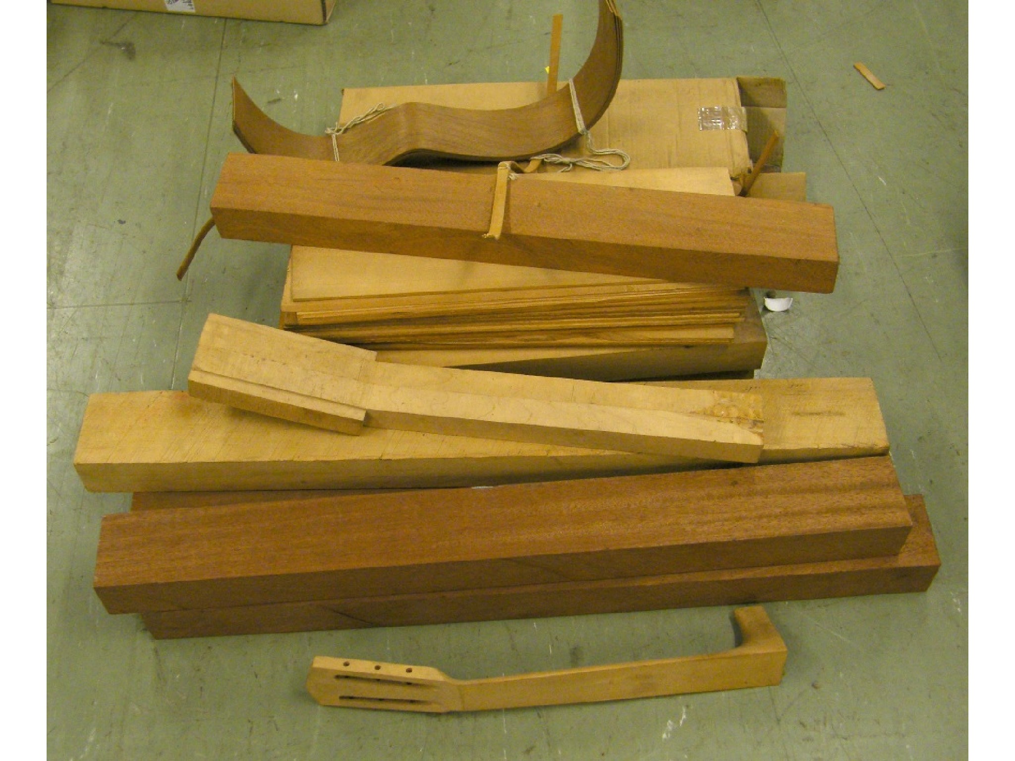 Appraisal: Quantity of guitar making wood together with a guitar neck