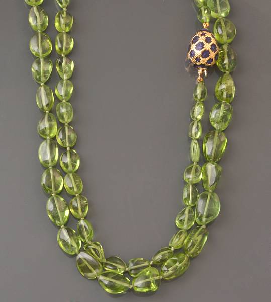 Appraisal: A peridot beaded necklace with an enamel and k gold