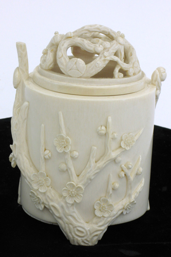 Appraisal: AN IVORY CARVED COVERED JAR with flowering cherry limbs on