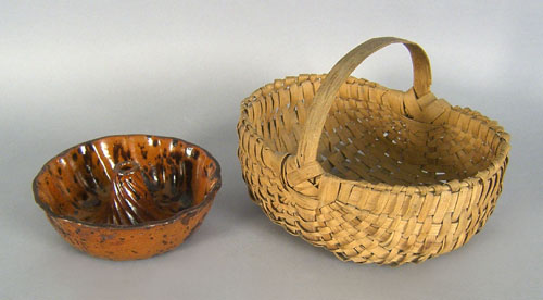 Appraisal: Redware food mold th c x together with a basket