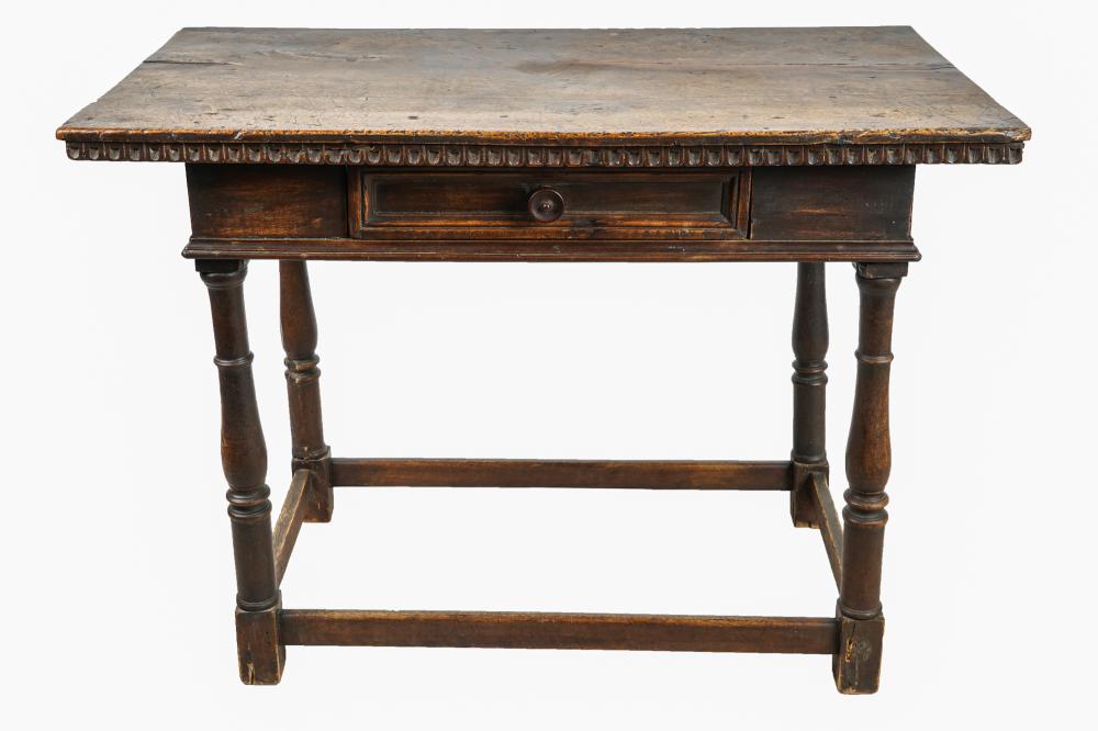 Appraisal: SPANISH CARVED WALNUT TABLEProvenance A Michael Smith installation inches wide