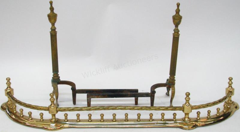 Appraisal: A pair of brass fireplace andirons Federal style and a