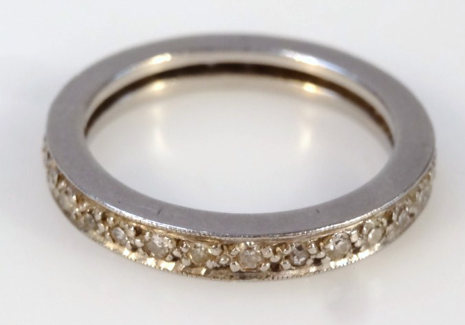 Appraisal: A ladies eternity ring set with small diamonds white metal