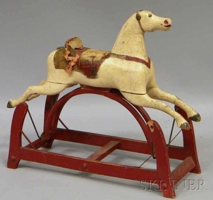 Appraisal: th Century Carved and Painted Wooden Gliding Horse with tack