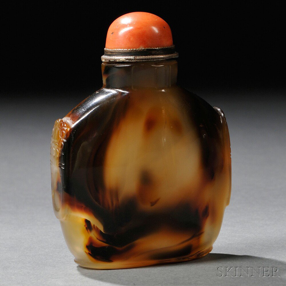 Appraisal: Agate Snuff Bottle with Coral Stopper China the flattened polygon