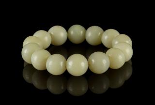 Appraisal: A Celadon Jade Bead Strand A Celadon Jade Bead Strand