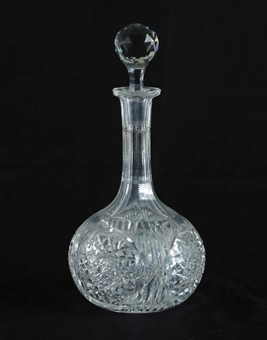 Appraisal: CUT GLASS DECANTER Bulbous shaped decorated with pinwheels and zipper