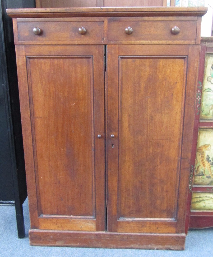 Appraisal: A th century mahogany linen press with single drawer over