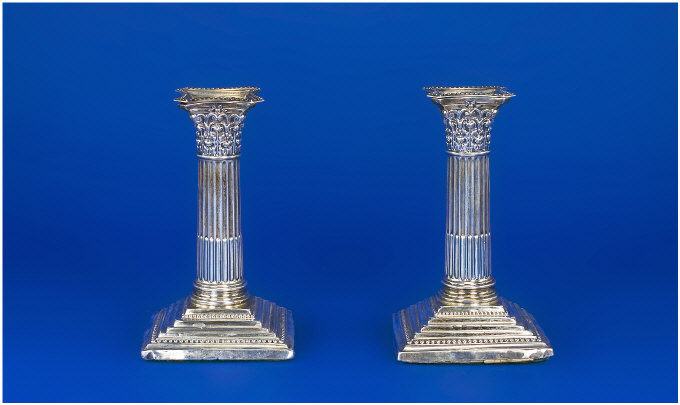 Appraisal: Pair of Silver Candlesticks Classical Corinthian columns on a square