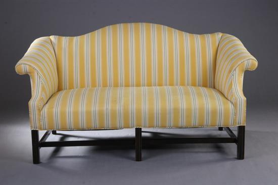 Appraisal: PAIR AMERICAN CHIPPENDALE STYLE CAMEL-BACK SOFAS th century Each serpentine