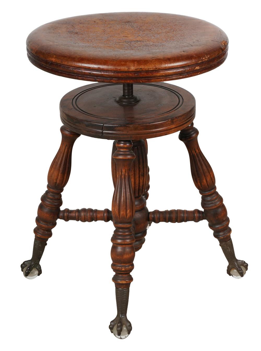 Appraisal: VICTORIAN PIANO STOOLwith leather-covered adjustable swivel seat the turned legs