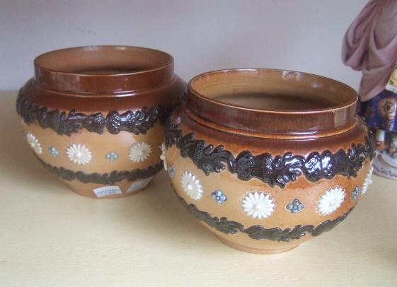 Appraisal: A pair of Doulton Lambeth saltglaze stoneware jardinieres with carved