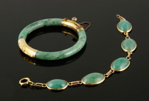 Appraisal: - Chinese K Jade Bracelets Two Chinese K gold and