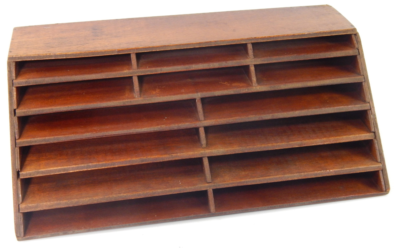 Appraisal: An oak stationery rack cm x cm x cm