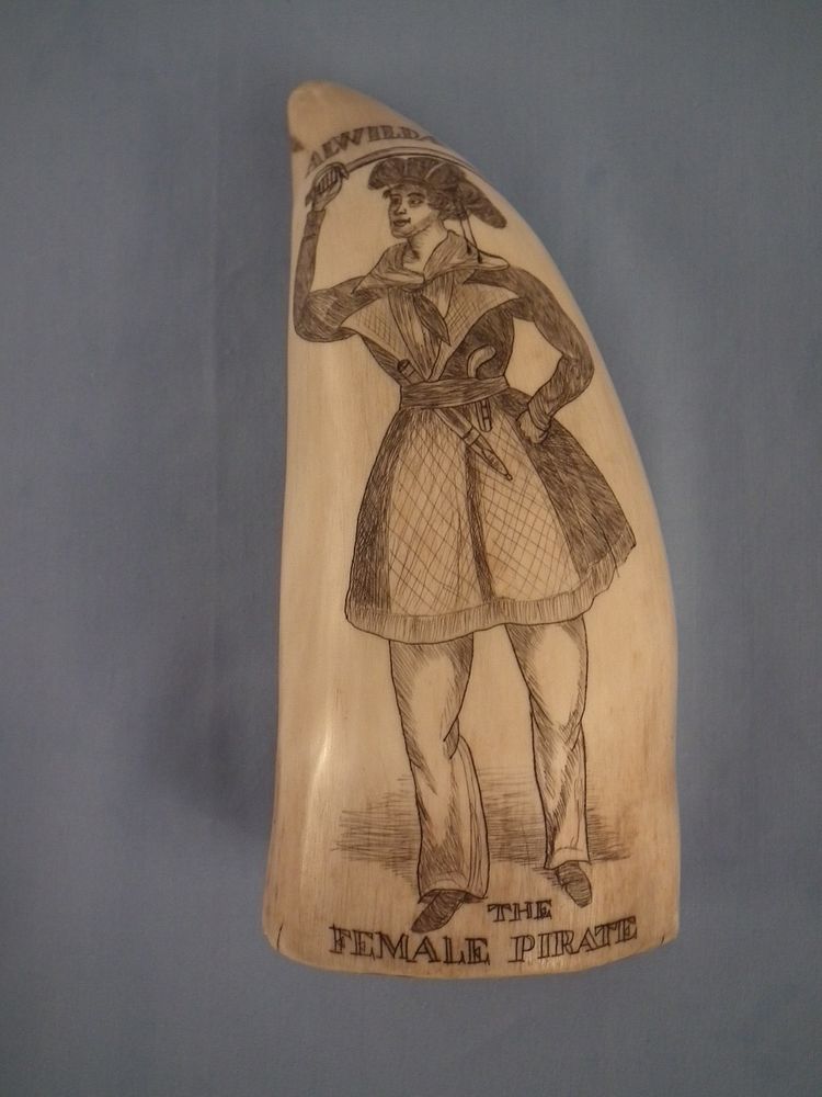 Appraisal: FEMALE PIRATE WHALE TOOTH Scrimshaw whale tooth depicting AWILDA THE