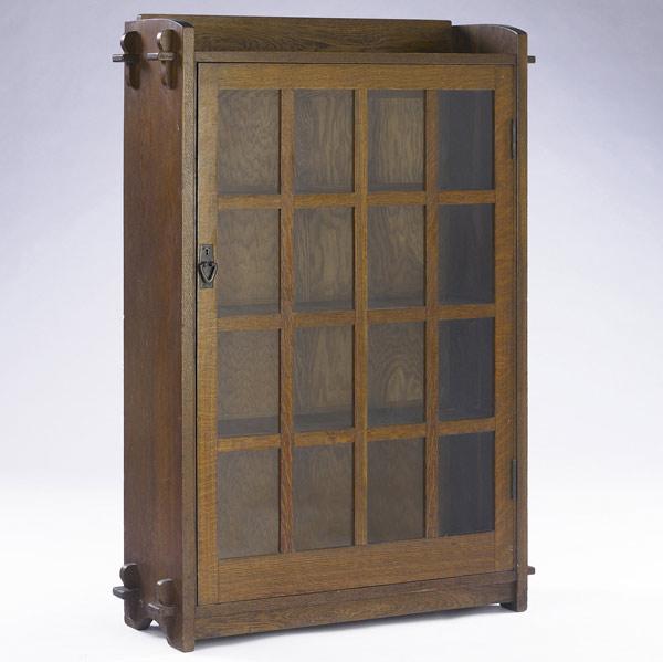 Appraisal: GUSTAV STICKLEY Single-door bookcase no its gallery top and base