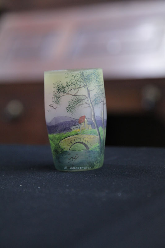 Appraisal: PAINTED AND DECORATED GLASS TUMBLER Depicting a bridge cottage and