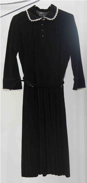 Appraisal: Dinner dress in black velvet with lace trim to the