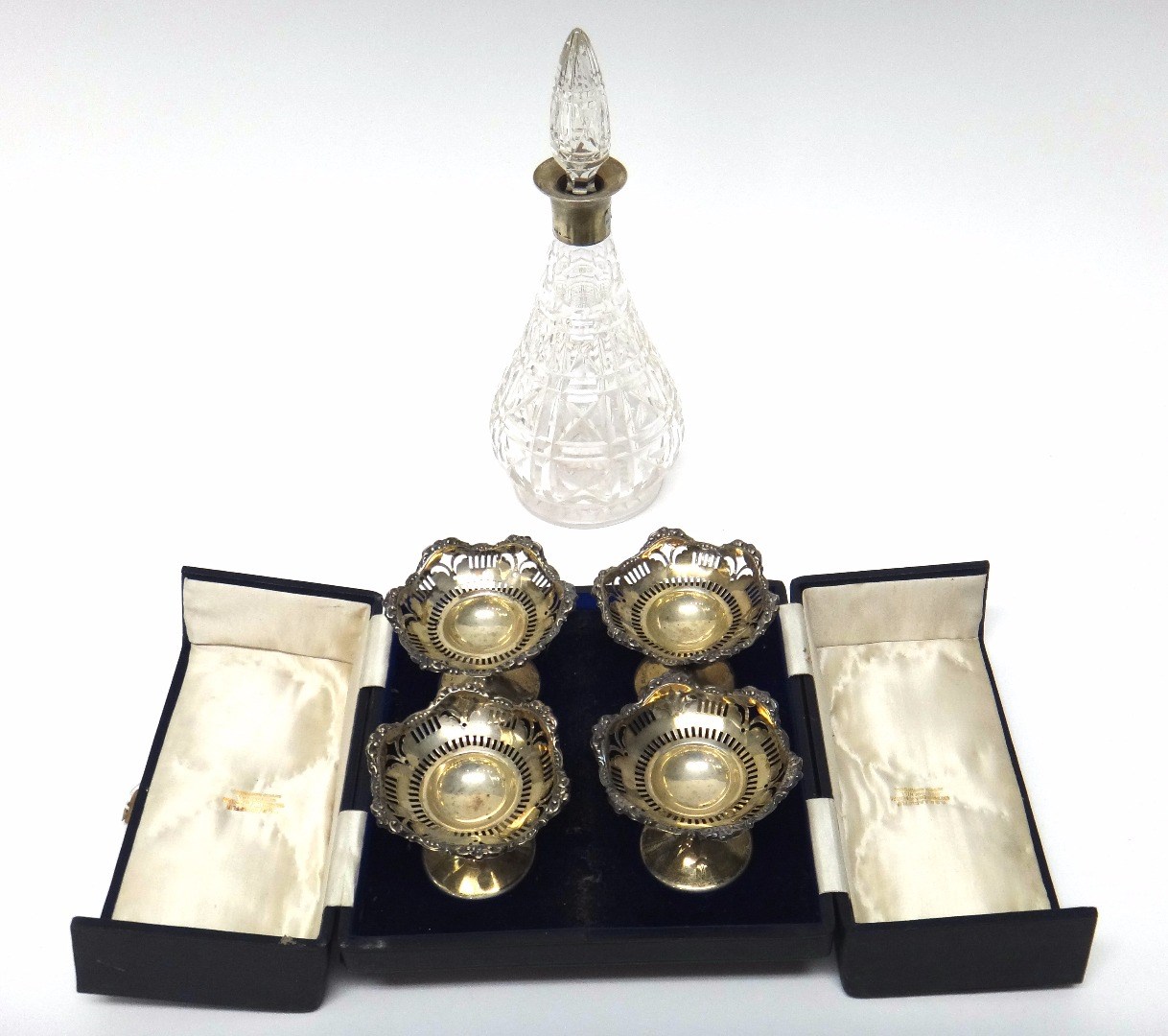 Appraisal: Four silver pedestal bon bon dishes each with embossed and