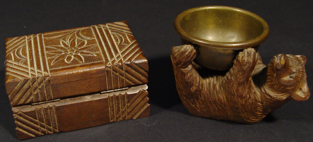 Appraisal: Black Forest carved wooden bear supporting a brass bowl together