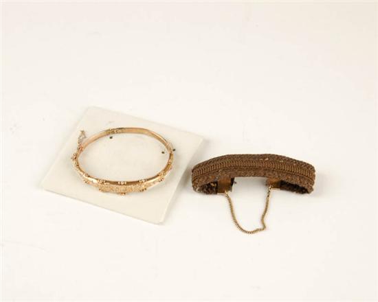 Appraisal: Two th C Bracelets a gold filled hinged bangle with