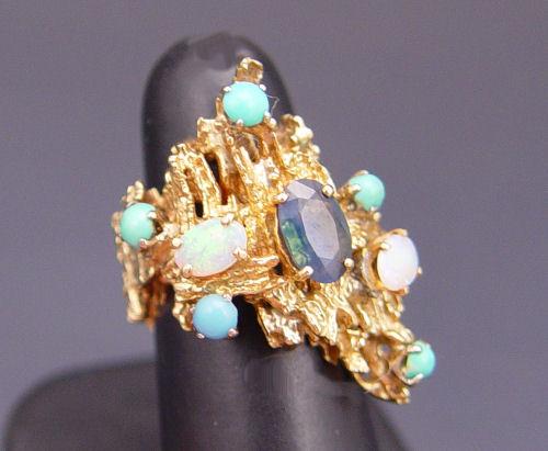 Appraisal: K SAPPHIRE OPAL TURQUOISE RING K yellow gold ring centers