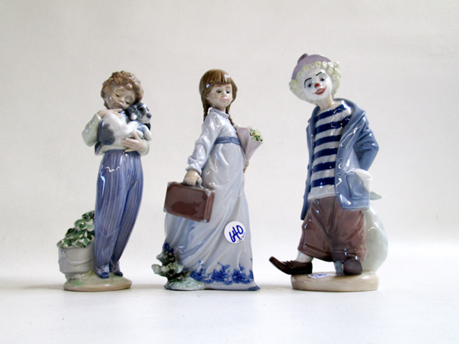 Appraisal: THREE LLADRO PORCELAIN FIGURINES Little Traveler issued sculptor Juan Huerta