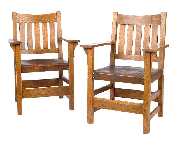 Appraisal: A pair of Gustav Stickley oak open armchairs similar to