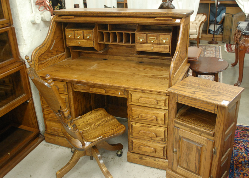 Appraisal: AN OAK ROLL-TOP DESK WITH CHAIR AND SMALL SIDE CABINET