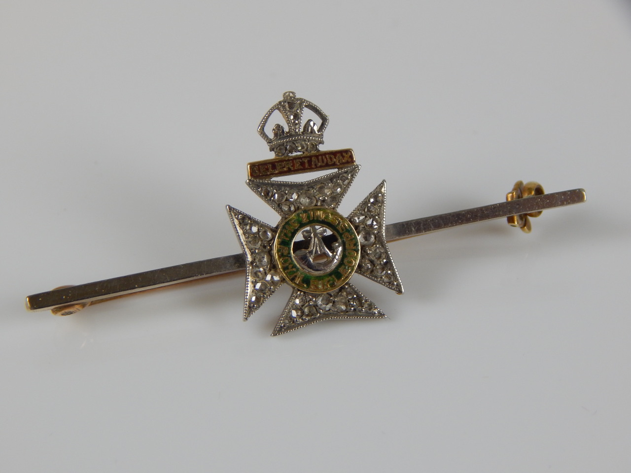 Appraisal: A Kings Royal Rifle Corps brooch with green and red