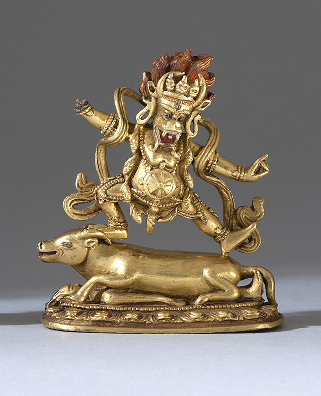 Appraisal: GILT-BRONZE FIGURE OF MAHAKALA th CenturyDancing on a prostrate figure