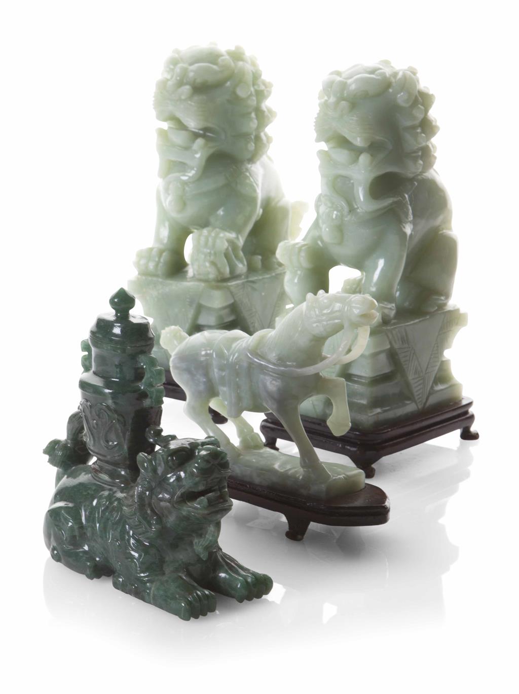 Appraisal: FOUR HARDSTONE CARVINGS comprising a light green horse a recumbent